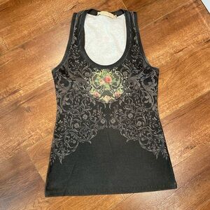 Racerback tank. Runs small!